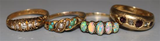 Four late 19th/early 20th century assorted 18ct gold and gem set dress rings, various sizes.